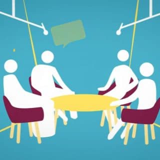 Grafika przedstawiająca cztery białe postacie siedzące przy stole
